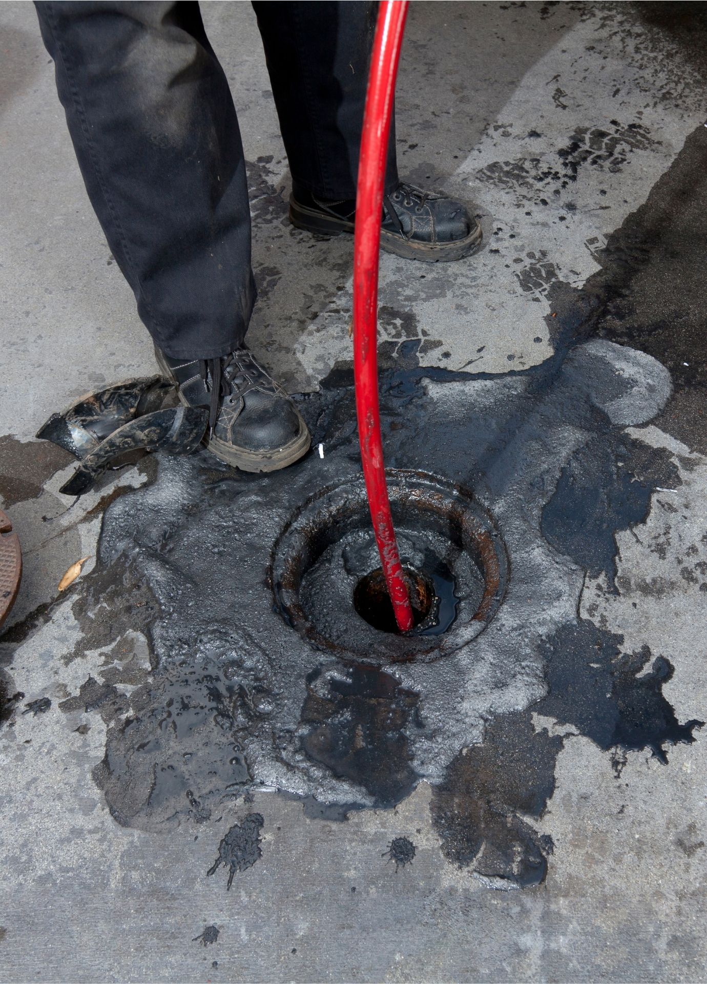 Professional equipment clearing a residential sewer line